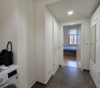 Hallway with washing machine and wardrobe
