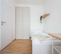 Compact bedroom with wardrobe and desk