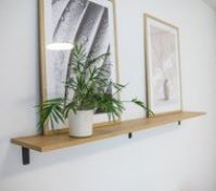 Decorative shelf with art and plant
