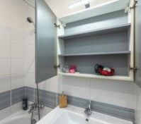 Bathroom mirror cabinet open