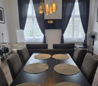 Elegant dining area with dark table