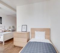 single bed inside the bedroom
