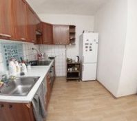 Kitchen with wooden cabinets and sink