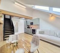 Kitchen and living space with staircase