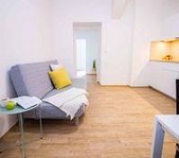 Living area sofa with kitchen view