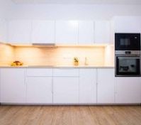 Full white kitchen with oven microwave