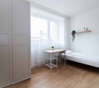 Bright bedroom with single bed wardrobe