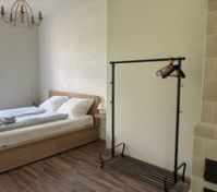 Bedroom with double bed and rack