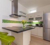 Bright kitchen with island and stools