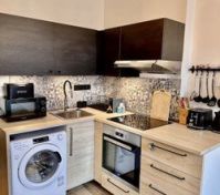 Full kitchen dark cabinets wood counters