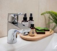 Bathroom faucet with toiletries closeup