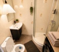 Bathroom with shower toilet washing machine