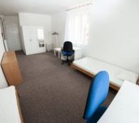 Bright bedroom with wardrobe and beds
