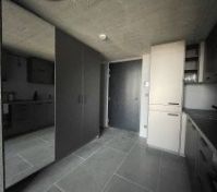 wardrobe area and kitchen