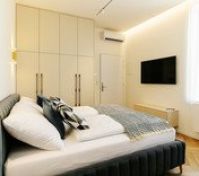 Bedroom with wardrobe and TV