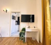 TV desk with kitchen entrance