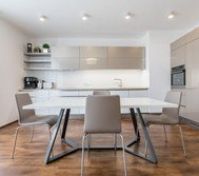 Kitchen & Living room with direct access to the terrace oriented to the South. All windows within the apartment have installed electric blinds.