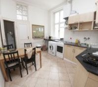 Kitchen with dining table and appliances