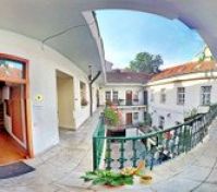 courtyard balcony accessible for guests , apartment door is on the left