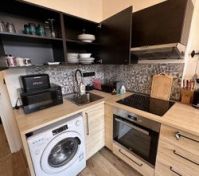Kitchen with oven washer appliances