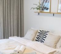Cozy double bed with curtains