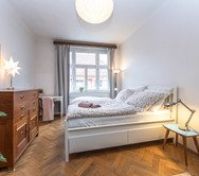 Bright bedroom with parquet floor