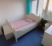Bright bedroom with single bed