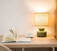 Desk lamp with book and cup