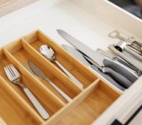 Organized cutlery drawer bamboo tray