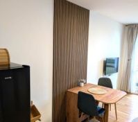 Dining table with wood slat panel