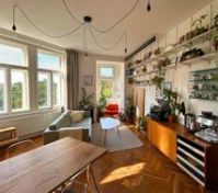 Living Room with a projector, coffee corner, reading nook, big dining table and more! 
