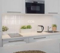 White kitchen with modern appliances