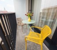 Balcony with colorful chairs and view
