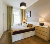 Cozy bedroom with green curtains