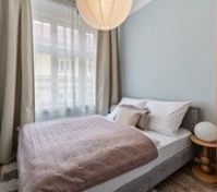 Cozy bedroom with pendant lamp