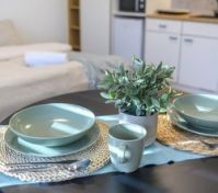 Dining table set with kitchen background