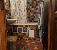 Colorful tiled bathroom with bathtub