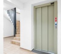 Building hallway with elevator and stairs