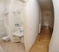 Bathroom with sink and hallway view