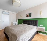 Bedroom with green accent wall