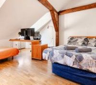 there is a single bed (under the double bed) which can slide out and sleeps additional 1 person. 