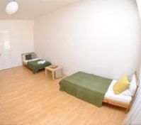 Spacious bedroom with two single beds