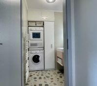 Toilet and laundry room downstairs.
