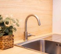 Kitchen sink with wood backsplash detail