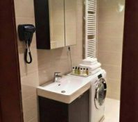 Bathroom with sink and washer