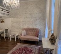 Living room sofa chandelier brick wall