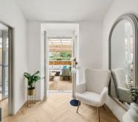 Hallway with armchair and terrace view