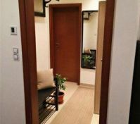 Entrance hallway with mirror and bench