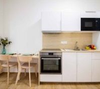 White kitchen with dining table