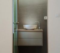 Bathroom vanity through glass door
